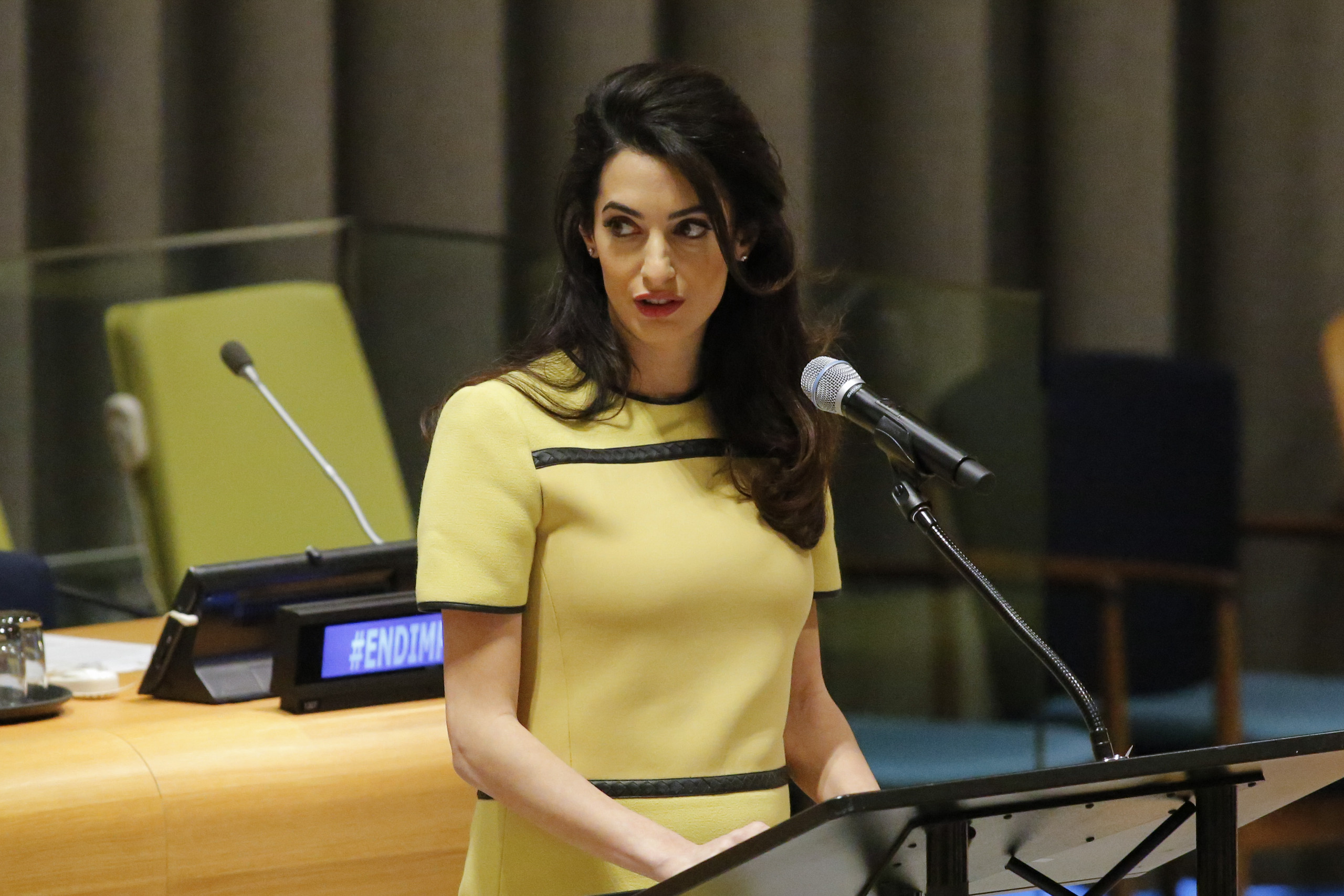 Amal Clooney "flaunting" her baby bump