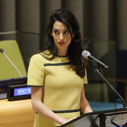 Amal Clooney "flaunting" her baby bump