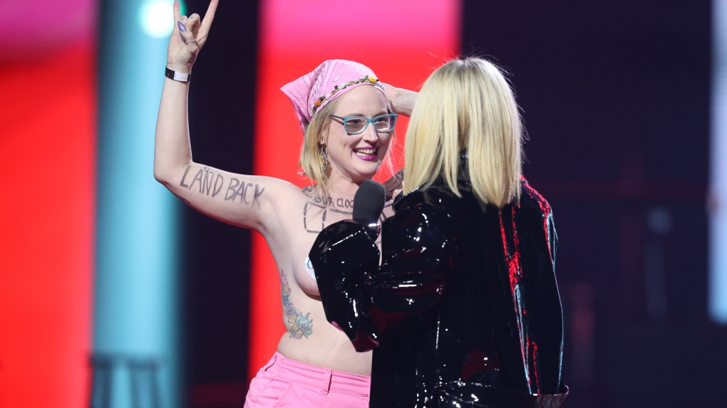 Avril Lavigne kicks topless protestor off Junos stage: 'Get the f--- off'