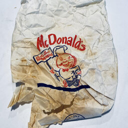 Couple finds antique Happy Meal of sorts in their wall