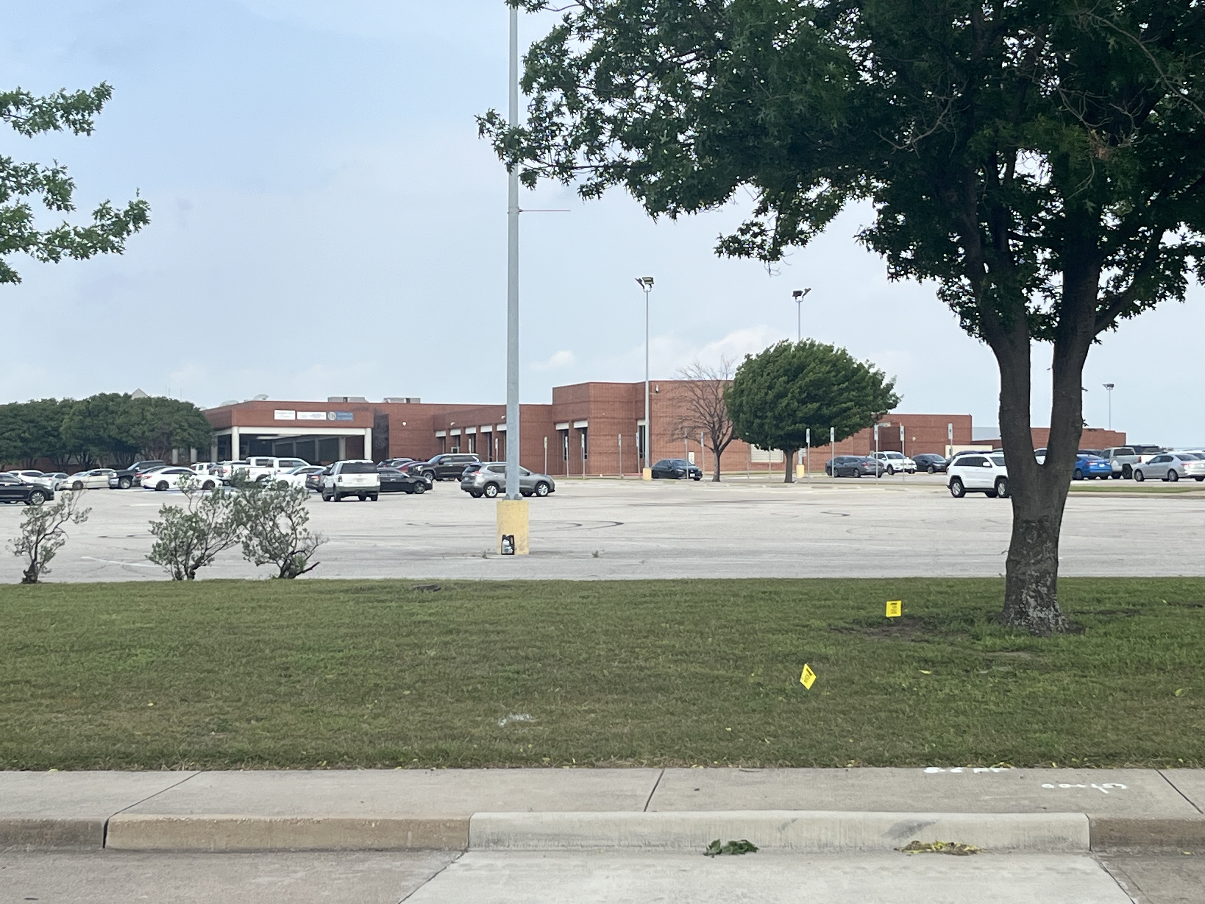 Students retrieve belongings from Bowie High School before classes resume Monday