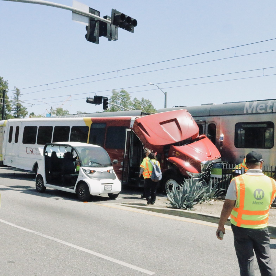 18 sent to the hospital after crash between USC bus, Metro train