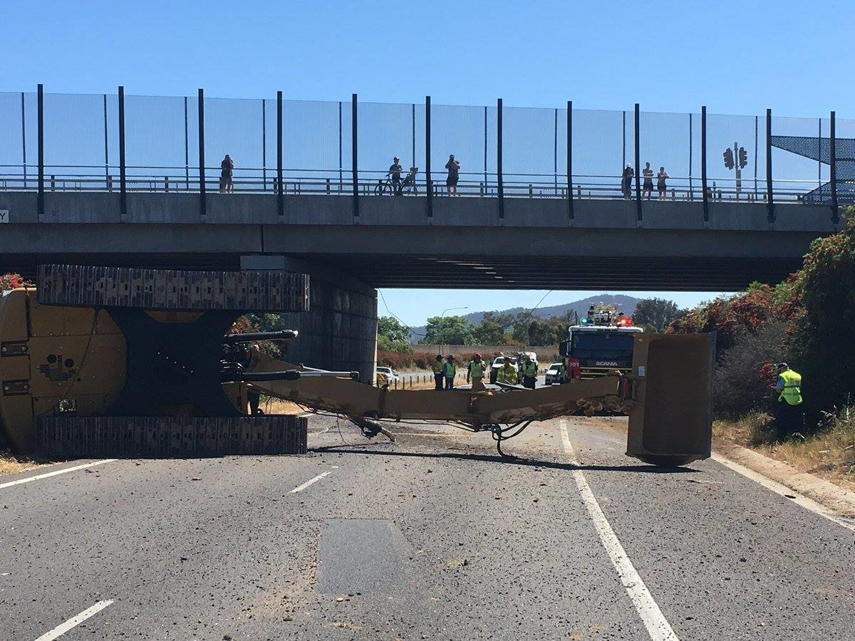 Excavator On Truck Hits Borella Road Overpass On Hume Highway