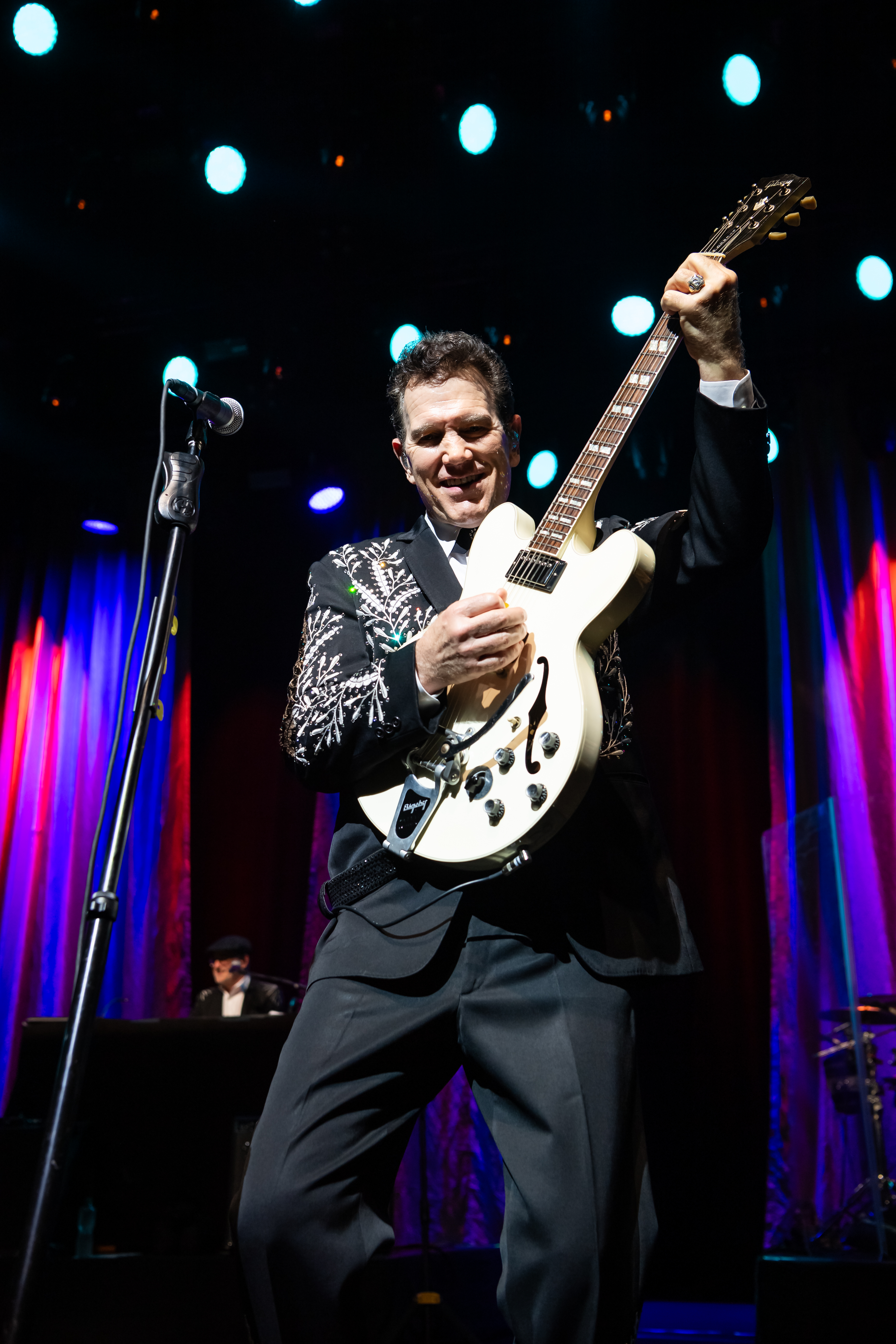 Chris Isaak Talks Australian Tour, Artistic Influences, and Surfing With Layne Beachley