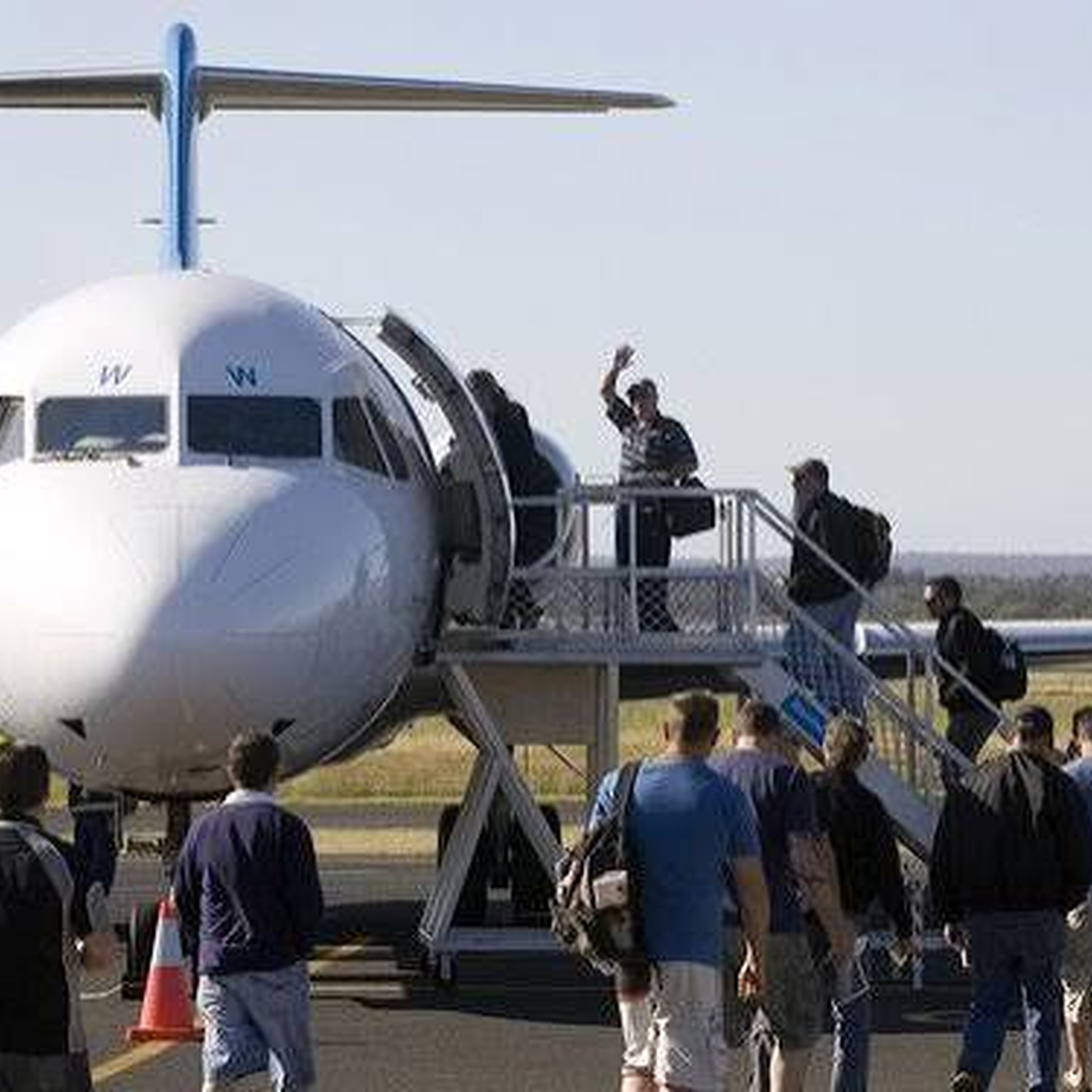 Busselton Airport turns purple as fans head to Melbourne