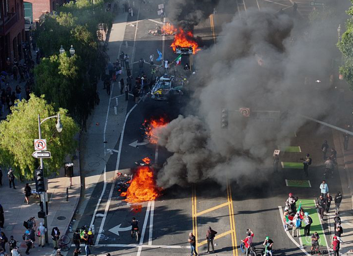 Downtown LA locked down as 8pm curfew kicks in after violent unrest