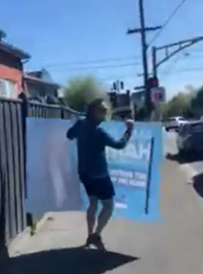 Teal MP's campaign sours as Monique Ryan's husband caught taking Liberal sign, pair apologise