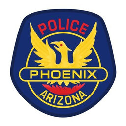 Phoenix Police Officer holds hand