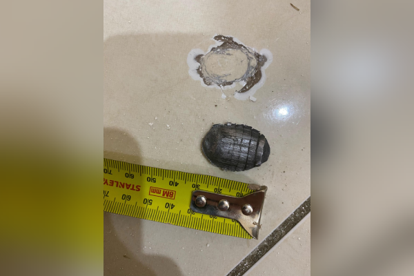 Metal mystery: Wild theories after rogue shard blasts through roof