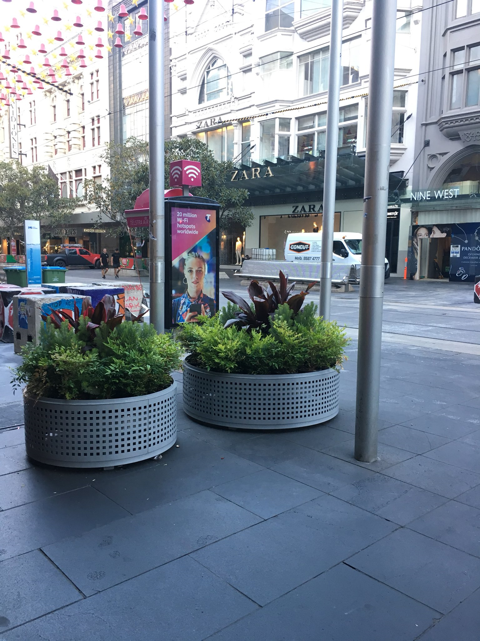 Ross and John cross to Bourke St where bollards are being replaced