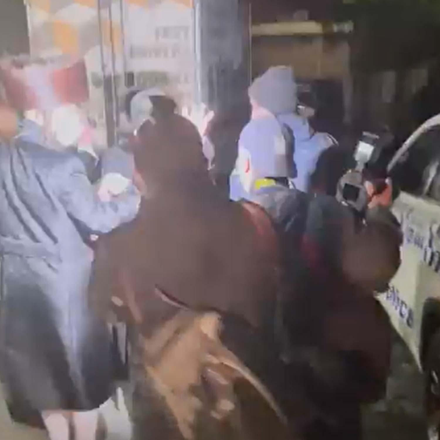 Cameraman hospitalised and worshippers fined after synagogue stand-off