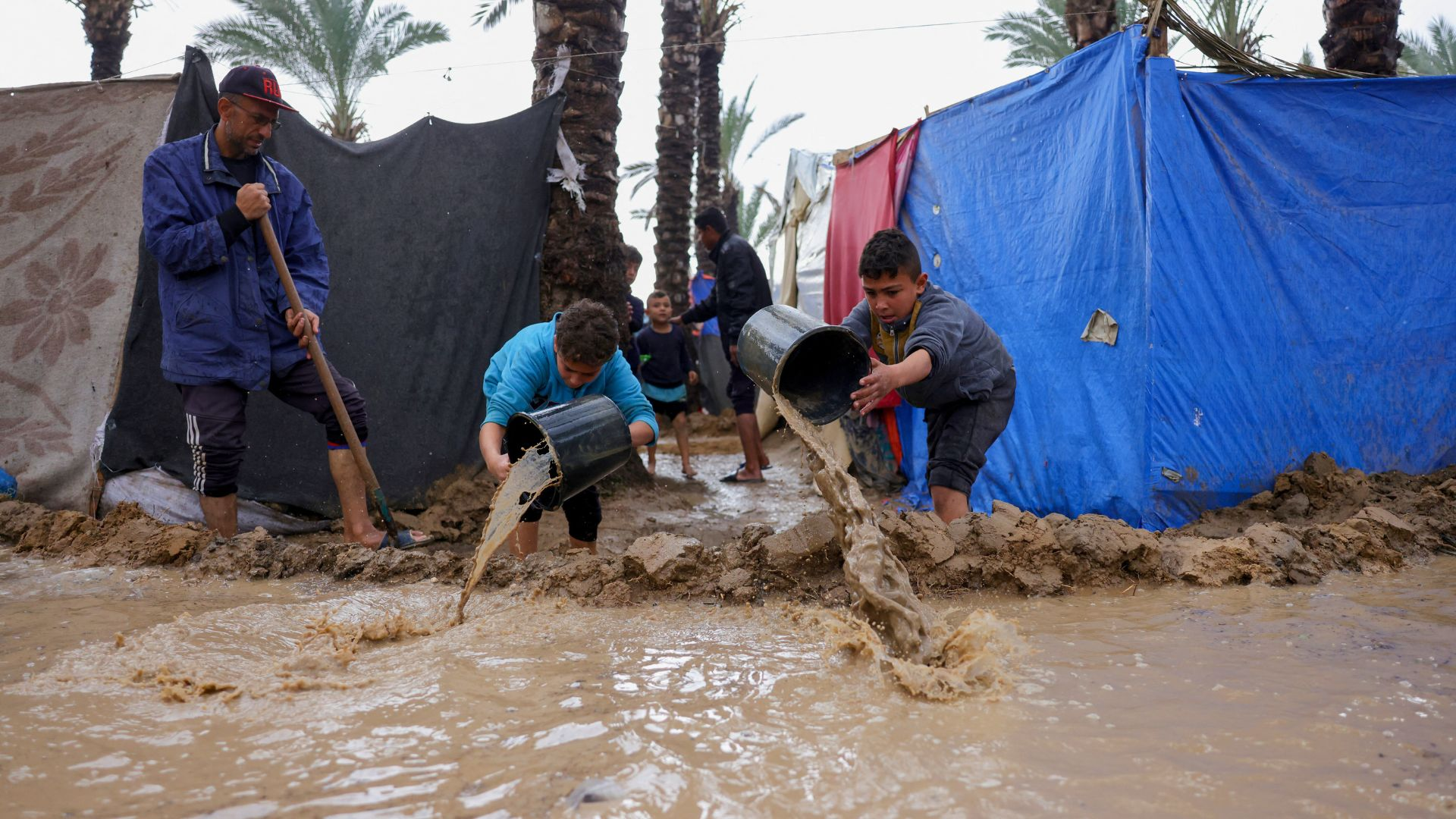 Displaced Palestinian families suffer as heavy rains flood Gaza tent camps