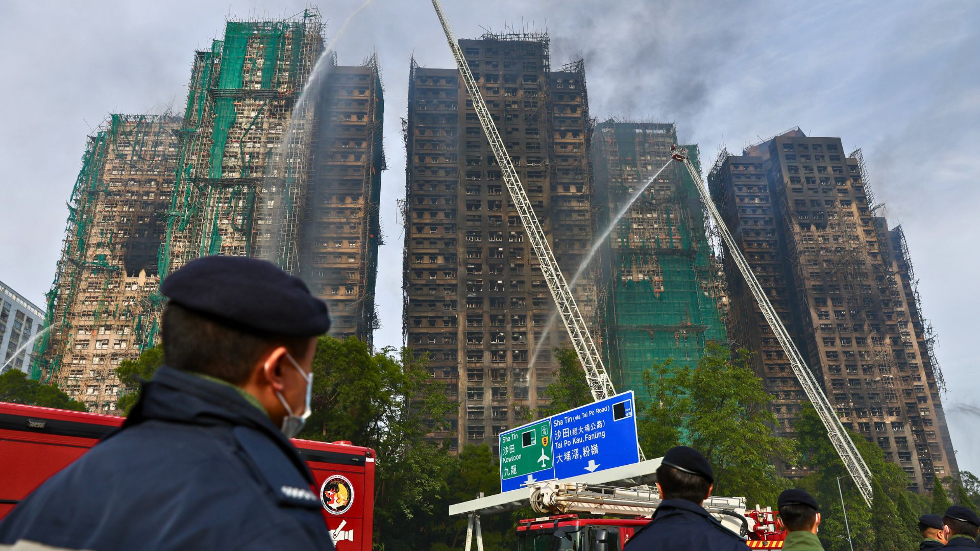 Hong Kong fire that killed dozens ‘under control’; hundreds still missing