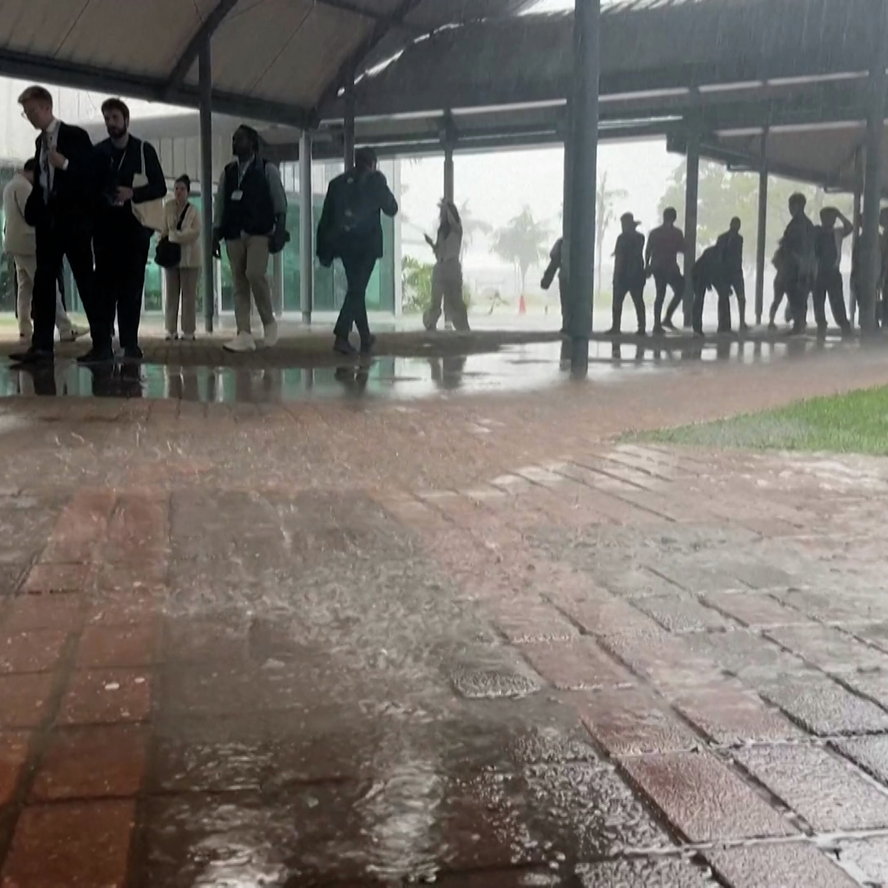 Heavy rains flood COP30 conference entrances Heavy rains flood COP30 conference entrances