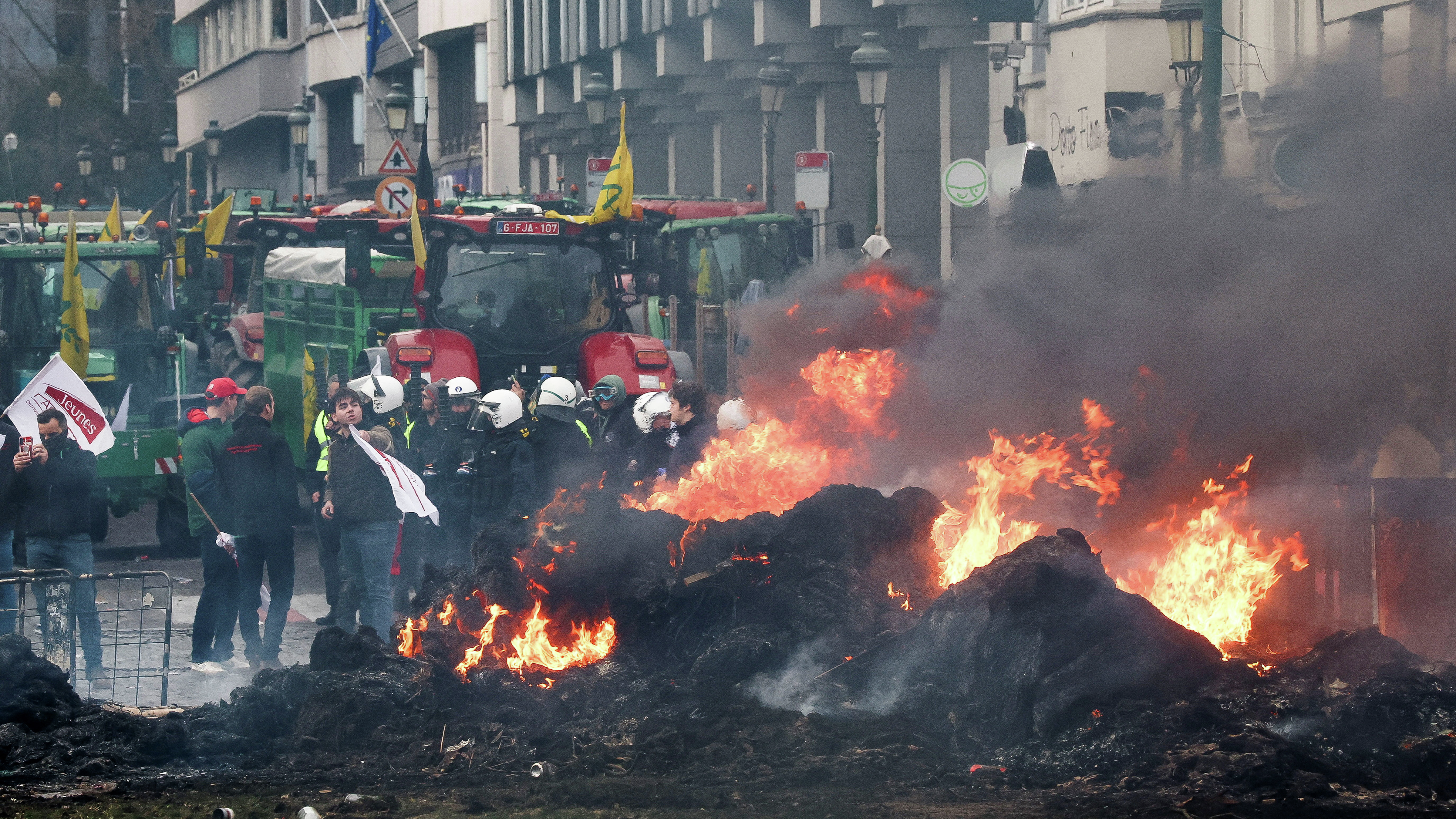Protesting farmers clash with police as EU debates trade deal