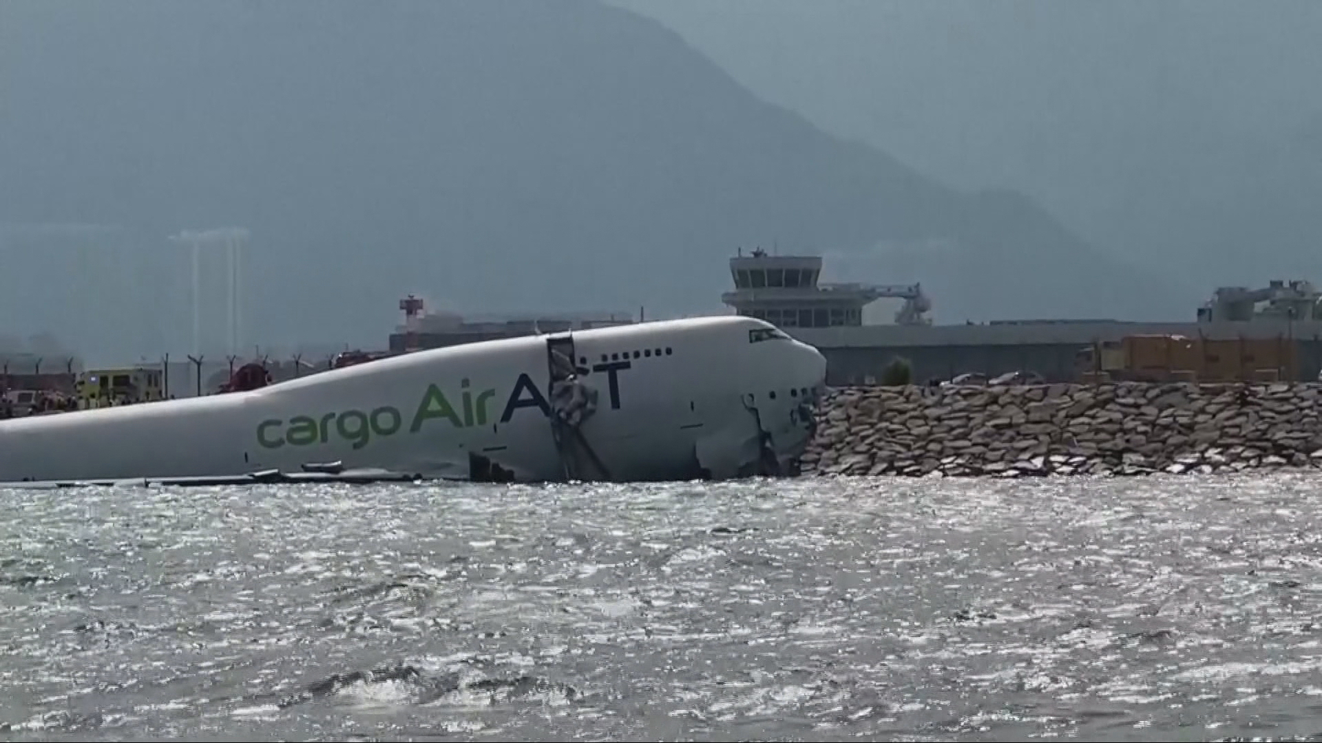 Two killed as cargo plane skids off Hong Kong runway