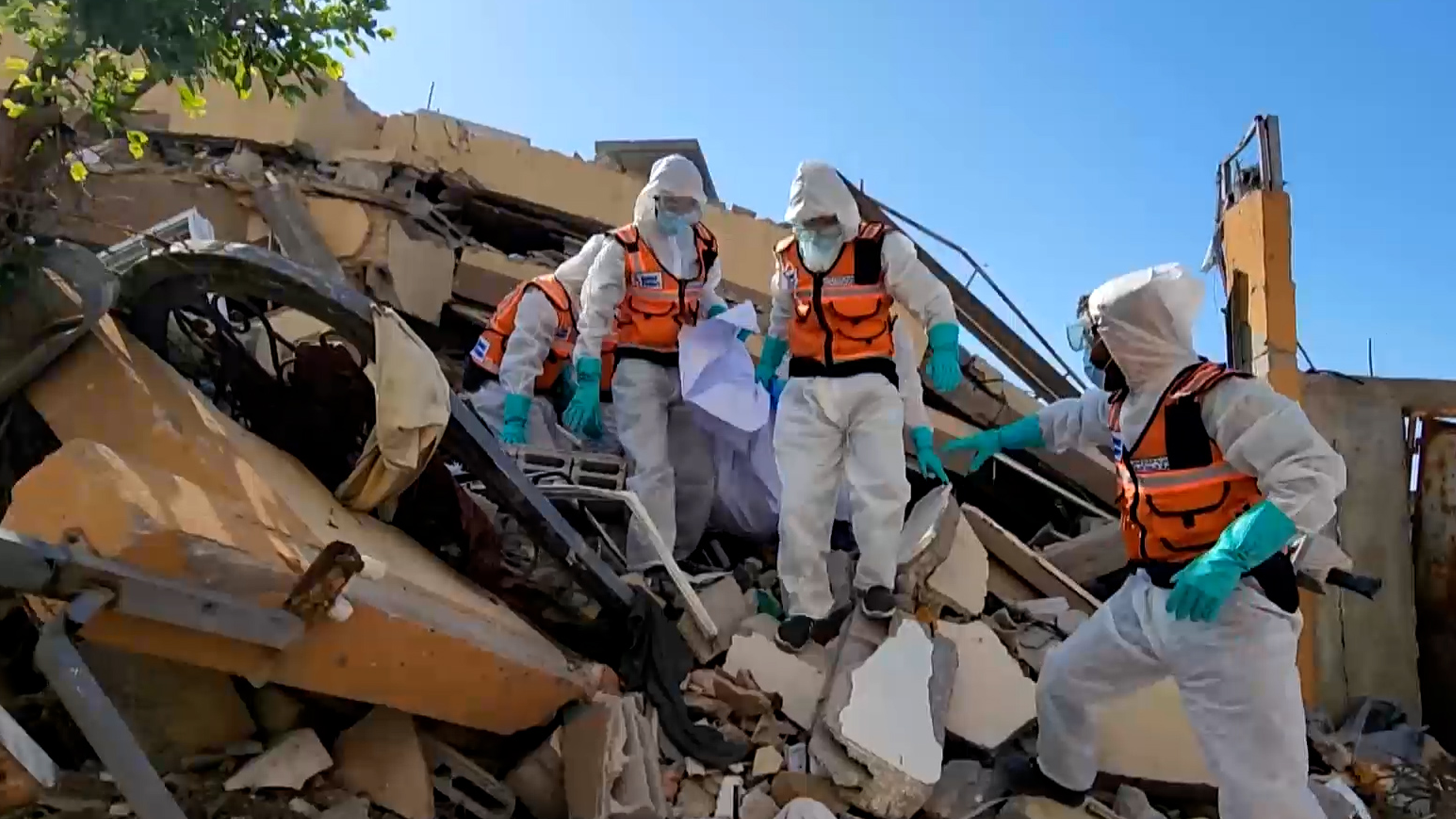 Emergency teams move hastily buried Palestinians to cemeteries