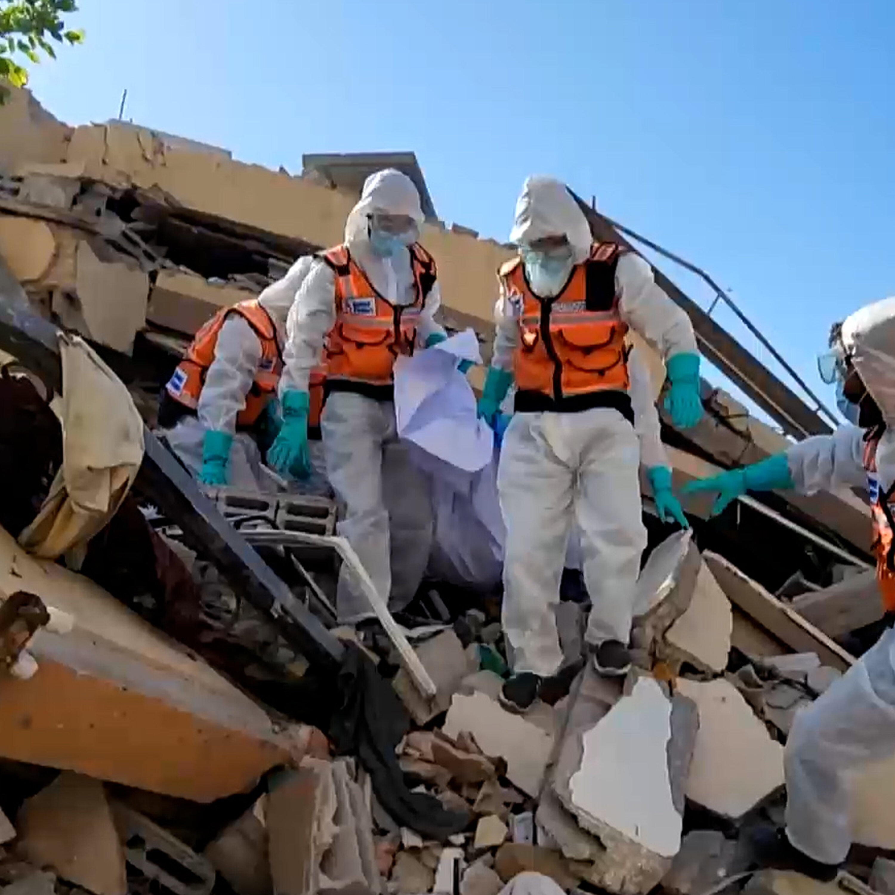 Emergency teams move hastily buried Palestinians to cemeteries Emergency teams move hastily buried Palestinians to cemeteries