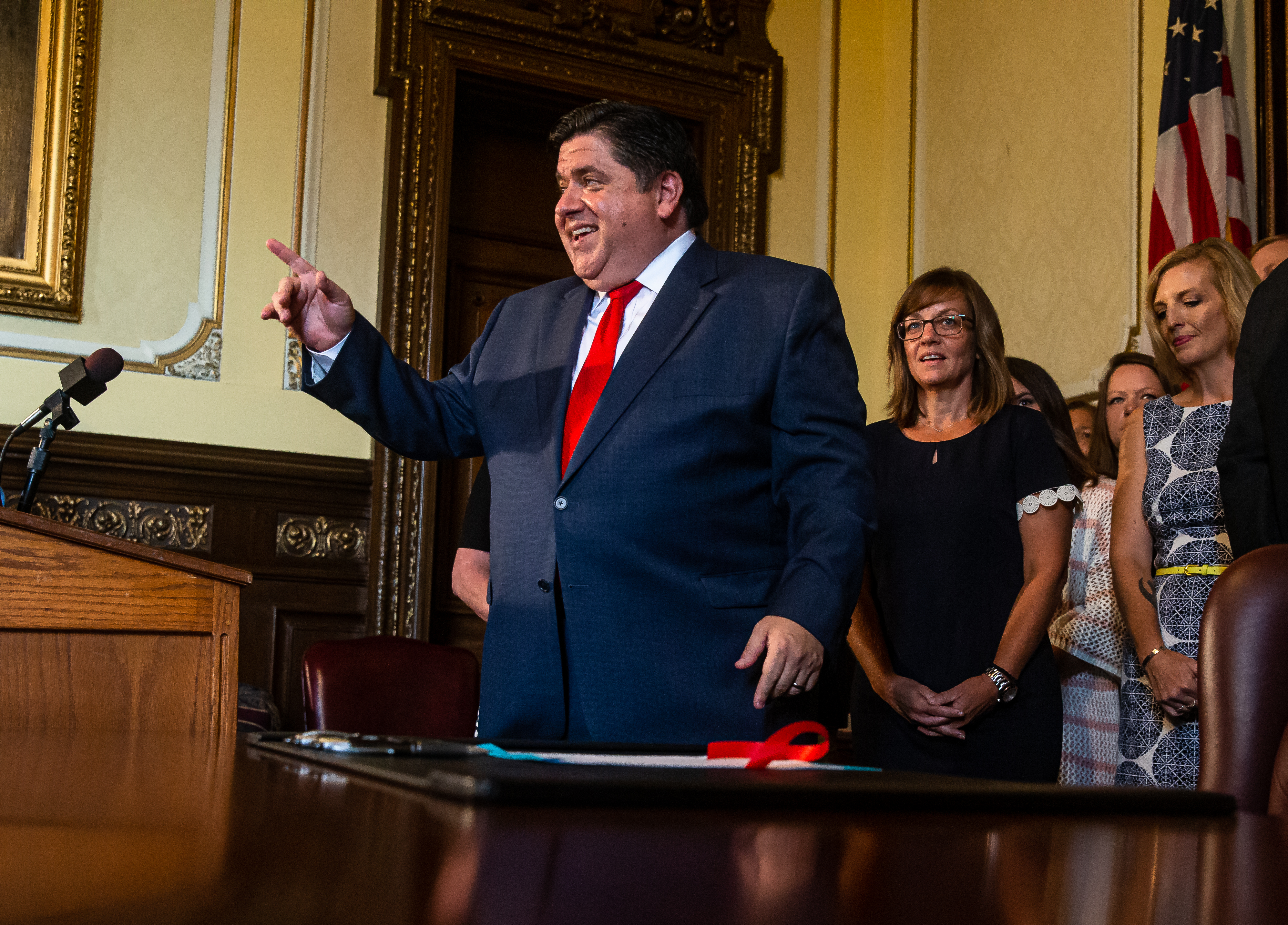 Gov. Pritzker's Broken Leg, nearly 600 bills signed, RFP to sell the Thompson Center episode artwork