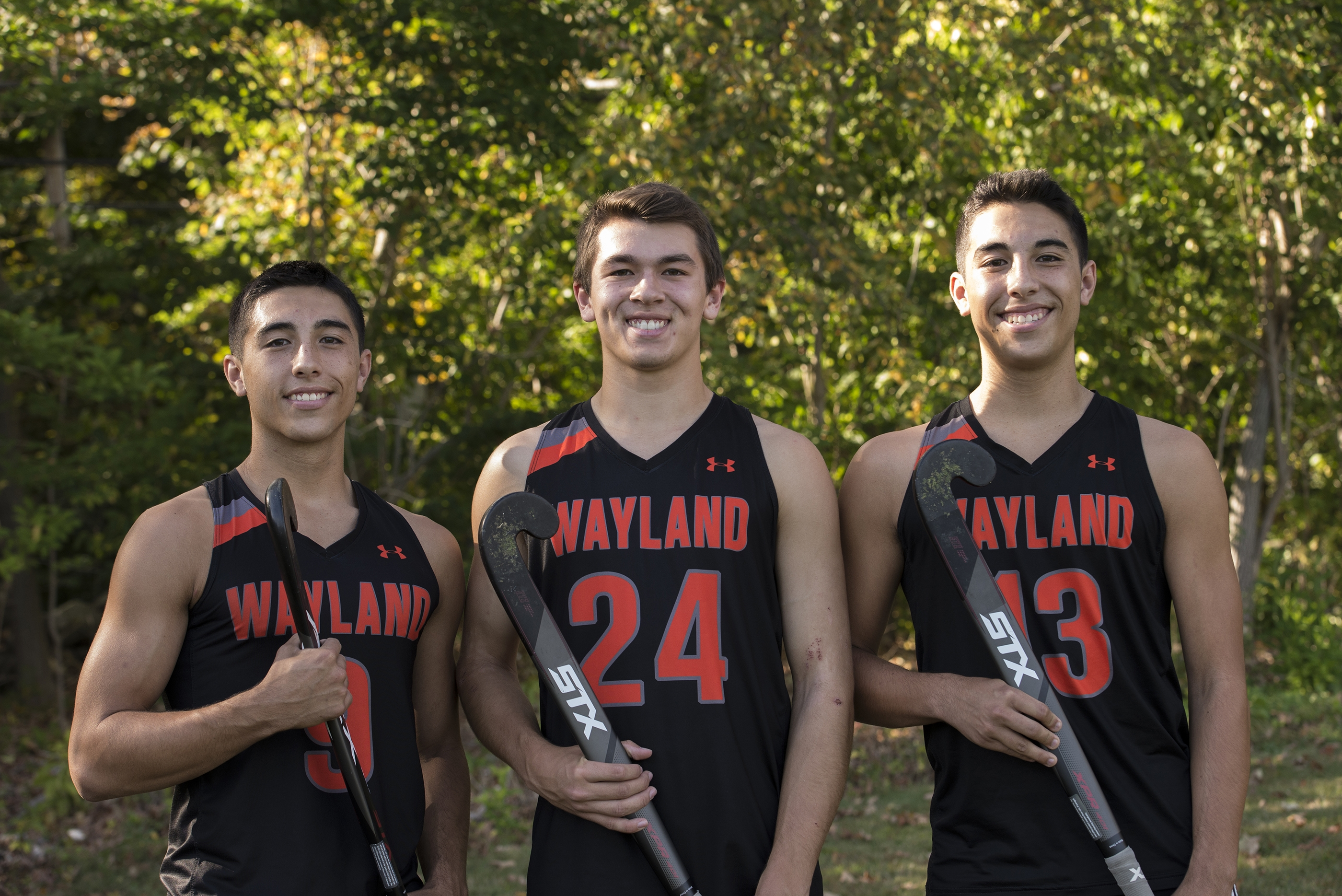 These boys are playing on Wayland High's field hockey team